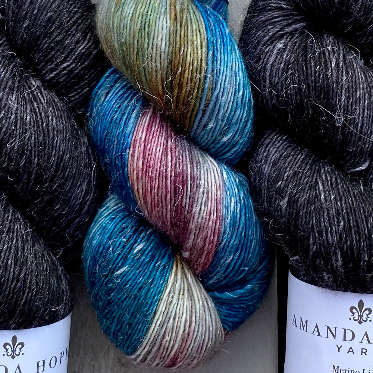 Misurina or Trelawny Top (Both are Crop Tees) Yarn in Noir & Boutique, Merino Linen (fingering weight)